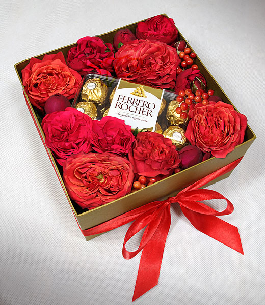 image of red luxury roses in a box with chocolates