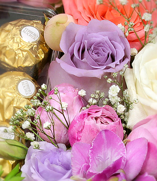 photo of flowers with box of chocolates